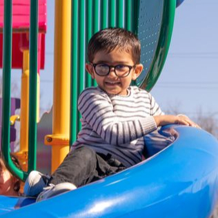 shadowbrook-weekday-school_boy-on-slide.jpeg